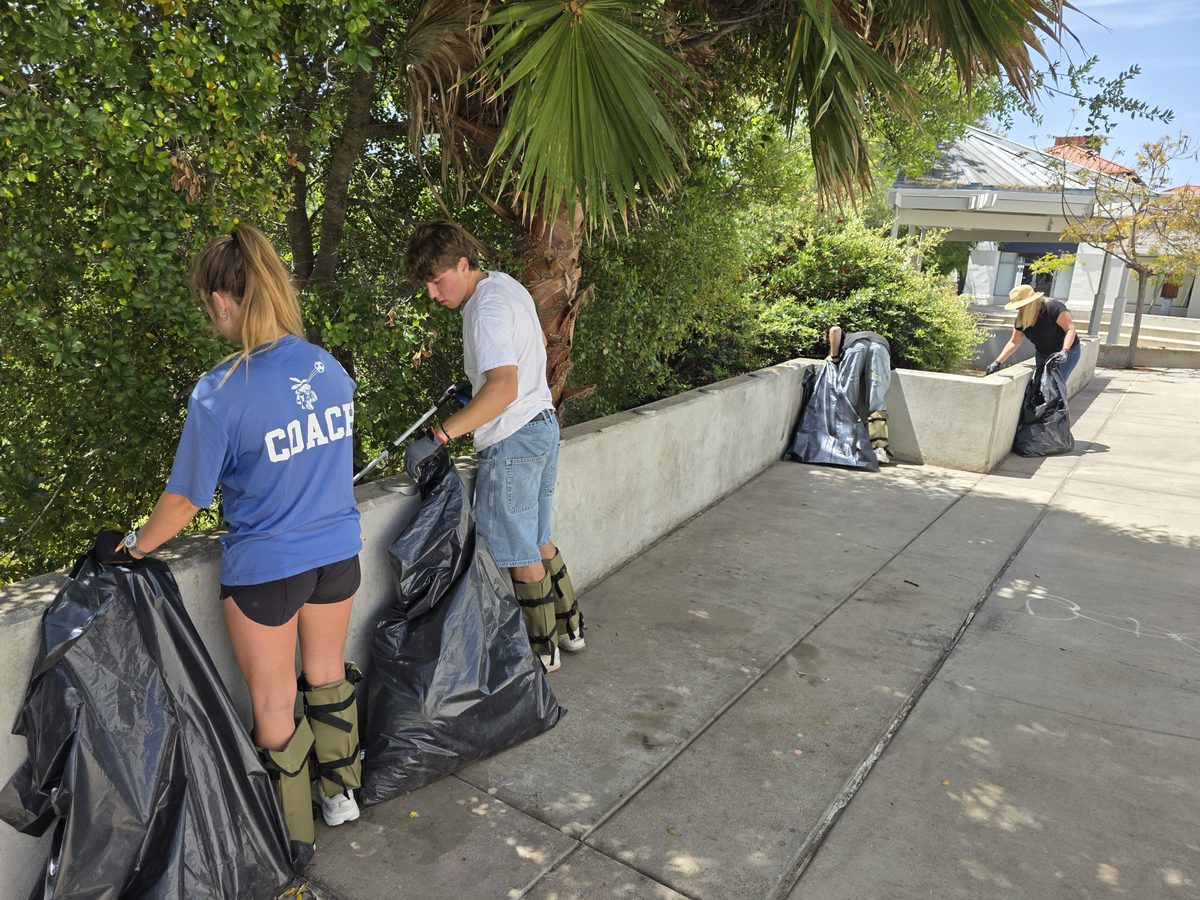 Crew cleaning shopping center walkway